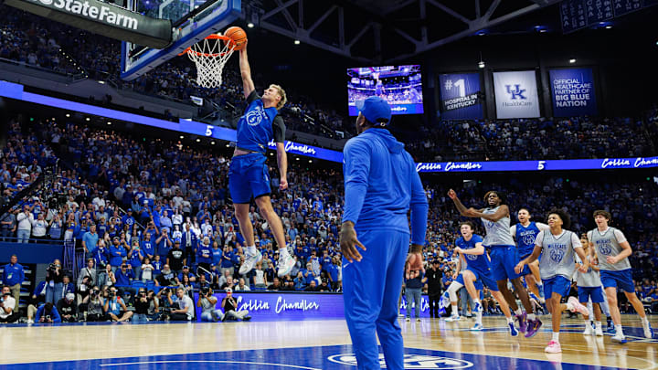 Oct 11, 2025; Lexington, KY, USA; Kentucky Wildcats guard Collin Chandler (5) gets an assist from former Kentucky Wildcat and NBA player John Wall as he competes in the dunk contest during Big Blue Madness at Rupp Arena at Central Bank Center. Mandatory Credit: Jordan Prather-Imagn Images