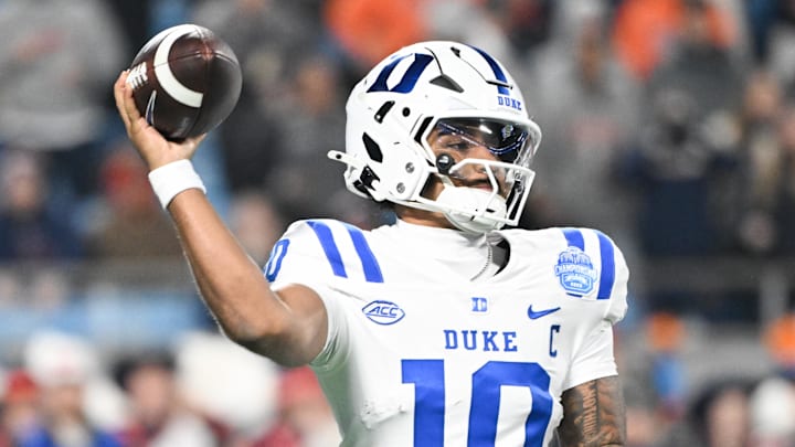 Dec 6, 2025; Charlotte, NC, USA; Duke Blue Devils quarterback Darian Mensah (10) throws in the second quarter against the Virginia Cavaliers during the 2025 ACC Championship game at Bank of America Stadium. Mandatory Credit: Bob Donnan-Imagn Images