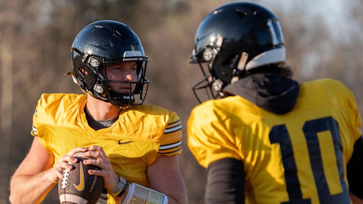 Iowa quarterbacks Hank Brown (9) and Jeremy Hecklinski (10) runs drills during practice April 9, 2026 in Iowa City, Iowa.