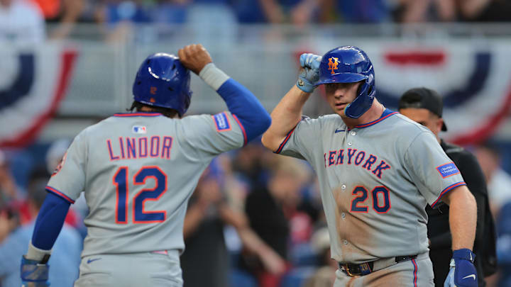 Apr 2, 2025; Miami, Florida, USA; New York Mets first baseman Pete Alonso (20) celebrates with shortstop Francisco Lindor (12) after hitting a three-run home run against the Miami Marlins during the eighth inning at loanDepot Park. Mandatory Credit: Sam Navarro-Imagn Images