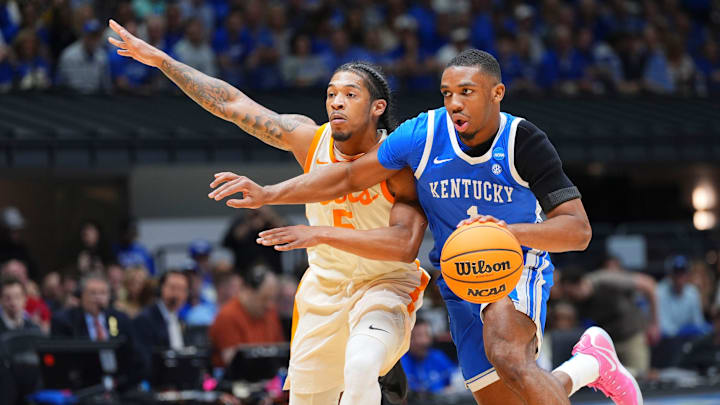 Kentucky guard Lamont Butler (1) moves the ball while guarded by Tennessee guard Zakai Zeigler (5) during the NCAA Tournament Sweet 16 on Friday, March 28, 2025, in Indianapolis, IN