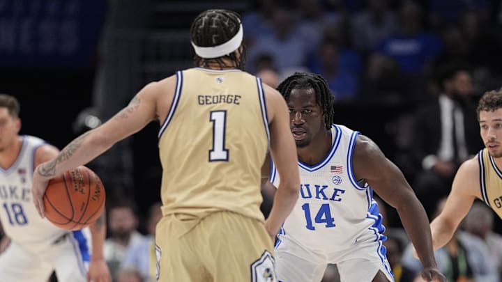 Mar 13, 2025; Charlotte, NC, USA; Duke Blue Devils guard Sion James (14) on defense against Georgia Tech Yellow Jackets guard Naithan George (1) during the second half at Spectrum Center. Mandatory Credit: Jim Dedmon-Imagn Images