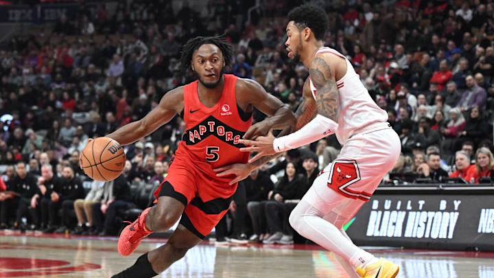 Feb 5, 2026; Toronto, Ontario, CAN; Toronto Raptors guard Immanuel Quickley (5) dribbles past Chicago Bulls guard Anfernee Simons (2) in the first half at Scotiabank Arena. Mandatory Credit: Dan Hamilton-Imagn Images