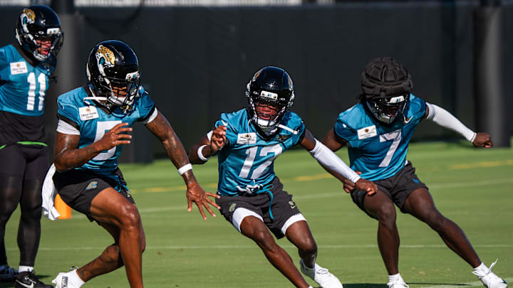 Jacksonville Jaguars wide receiver Dyami Brown (5), Jacksonville Jaguars wide receiver Travis Hunter (12) and Jacksonville Jaguars wide receiver Brian Thomas Jr. (7) run a drill during an NFL training camp second session at the Miller Electric Center, Thursday, July 24, 2025, in Jacksonville, Fla. [Doug Engle/Florida Times-Union]