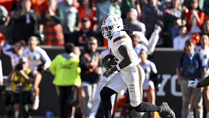 Dec 20, 2025; College Station, TX, USA; Miami Hurricanes running back Mark Fletcher Jr. (4) runs the ball during the second half against the Texas A&M Aggies at Kyle Field. Mandatory Credit: Maria Lysaker-Imagn Images