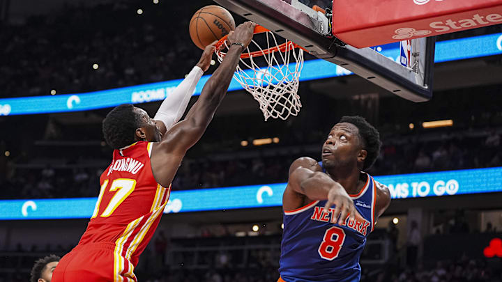 Nov 6, 2024; Atlanta, Georgia, USA; New York Knicks forward OG Anunoby (8) defends the rim against Atlanta Hawks forward Onyeka Okongwu (17) during the second half at State Farm Arena. Mandatory Credit: Dale Zanine-Imagn Images