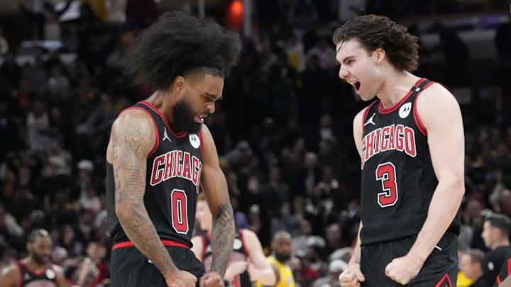 Mar 27, 2025; Chicago, Illinois, USA; Chicago Bulls guard Coby White (0) celebrates his three point basket against the Los Angeles Lakers with guard Josh Giddey (3) during the second half at United Center. Mandatory Credit: David Banks-Imagn Images