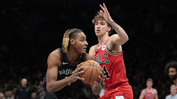 Jan 16, 2026; Brooklyn, New York, USA; Brooklyn Nets forward Noah Clowney (21) goes to the basket as Chicago Bulls forward Matas Buzelis (14) defends during the first half at Barclays Center. Mandatory Credit: Vincent Carchietta-Imagn Images