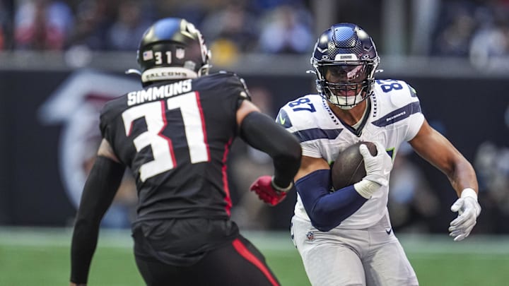 Oct 20, 2024; Atlanta, Georgia, USA; Seattle Seahawks tight end Noah Fant (87) runs against Atlanta Falcons safety Justin Simmons (31) during the first half at Mercedes-Benz Stadium. Mandatory Credit: Dale Zanine-Imagn Images