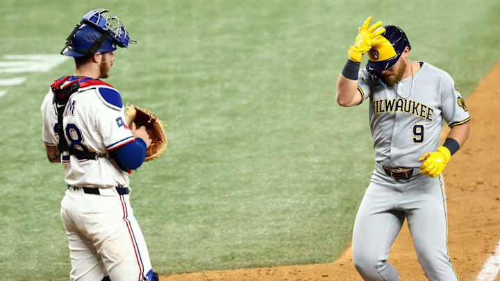 Sep 9, 2025; Arlington, Texas, USA; Milwaukee Brewers pinch hiyyer Jake Bauers (9) crosses home plate in fron tof Texas Rangers catcher Jonah Heim (28) after hitting a home run during the ninth inning at Globe Life Field. Mandatory Credit: Kevin Jairaj-Imagn Images Sep 9, 2025; Arlington, Texas, USA; Milwaukee Brewers pinch hiyyer Jake Bauers (9) crosses home plate in fron tof Texas Rangers catcher Jonah Heim (28) after hitting a home run during the ninth inning at Globe Life Field. Mandatory Credit: Kevin Jairaj-Imagn Images