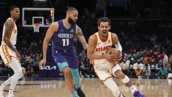Feb 14, 2024; Charlotte, North Carolina, USA; Atlanta Hawks guard Trae Young (11) handles the ball