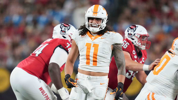 Tennessee linebacker Keenan Pili (11) celebrates making a defensive stop on the field at the NCAA College football game between Tennessee and NC State on Saturday, Sept. 7, 2024 in Charlotte, NC.