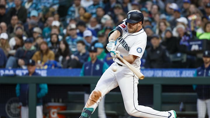 Seattle Mariners right fielder Luke Raley (20) hits an RBI-double against the Texas Rangers during the third inning at T-Mobile Park on April 12. Seattle Mariners right fielder Luke Raley (20) hits an RBI-double against the Texas Rangers during the third inning at T-Mobile Park on April 12.