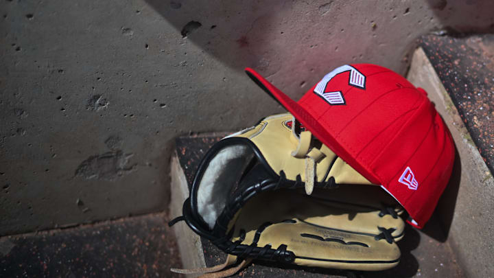 Apr 11, 2026; Cincinnati, Ohio, USA;  A view of an official Cincinnati Reds hat on the dugout steps during the game against the Los Angeles Angels at Great American Ball Park. Mandatory Credit: Aaron Doster-Imagn Images