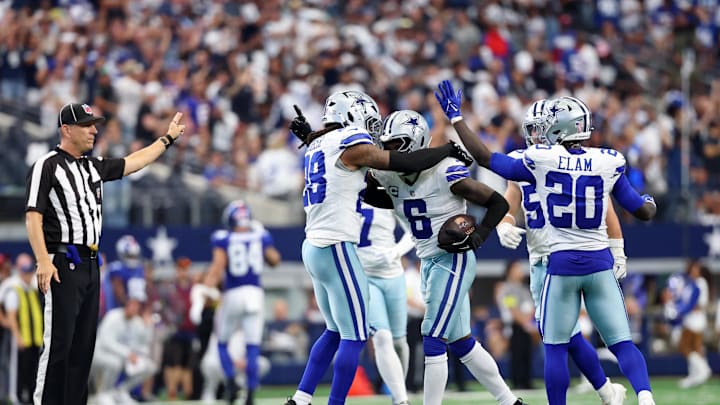 Sep 14, 2025; Arlington, Texas, USA; Dallas Cowboys safety Donovan Wilson (6) celebrates with safety Malik Hooker (28) after making an interception against the New York Giants during overtime at AT&T Stadium. Mandatory Credit: Kevin Jairaj-Imagn Images