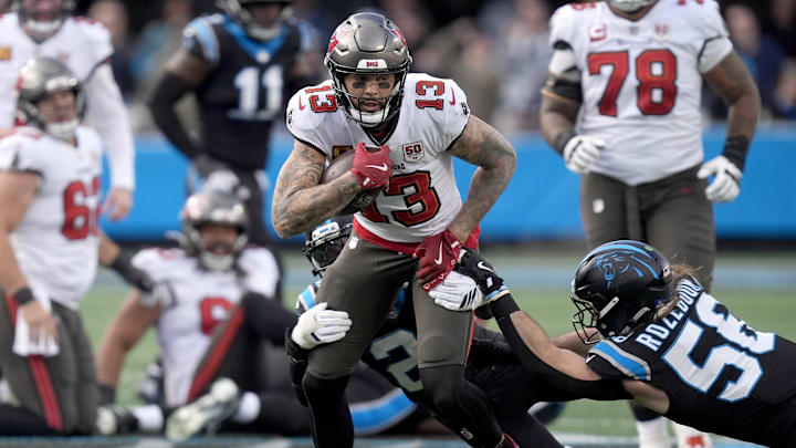 Dec 21, 2025; Charlotte, North Carolina, USA; Tampa Bay Buccaneers wide receiver Mike Evans (13) runs against Carolina Panthers linebacker Christian Rozeboom (56) during the second half at Bank of America Stadium. Mandatory Credit: Jim Dedmon-Imagn Images