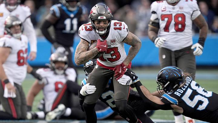 Dec 21, 2025; Charlotte, North Carolina, USA; Tampa Bay Buccaneers wide receiver Mike Evans (13) runs against Carolina Panthers linebacker Christian Rozeboom (56) during the second half at Bank of America Stadium. Mandatory Credit: Jim Dedmon-Imagn Images