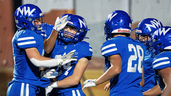 Waukee Northwest's Ben Gallagher (24) celebrates with teammates after running an interception back for a touchdown during a football game at Waukee Northwest High School on Friday, Sept. 26, 2025, in Waukee. Waukee Northwest's Ben Gallagher (24) celebrates with teammates after running an interception back for a touchdown during a football game at Waukee Northwest High School on Friday, Sept. 26, 2025, in Waukee.