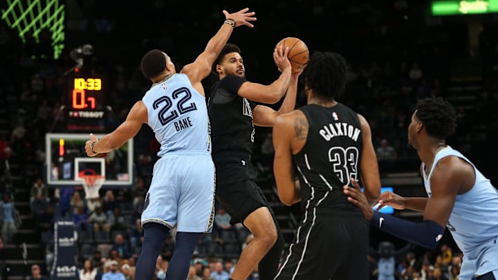 Dec 13, 2024; Memphis, Tennessee, USA; Brooklyn Nets forward Cameron Johnson (2) shoots as Memphis Grizzlies guard Desmond Bane (22) defends during the first quarter at FedExForum. Mandatory Credit: Petre Thomas-Imagn Images