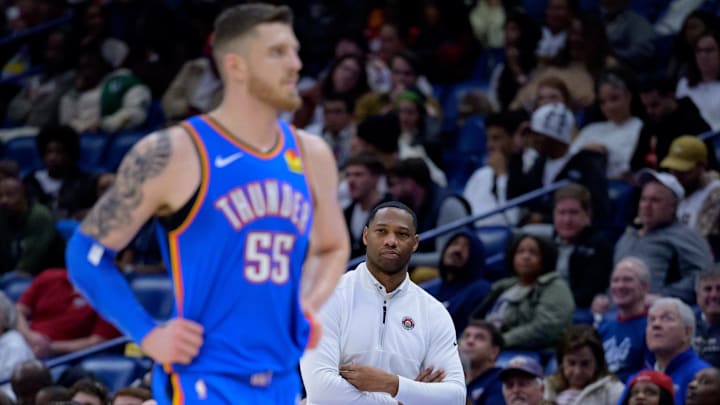 Dec 7, 2024; New Orleans, Louisiana, USA; New Orleans Pelicans head coach Willie Green watches Oklahoma City Thunder center Isaiah Hartenstein (55) during the first half at Smoothie King Center. Mandatory Credit: Matthew Hinton-Imagn Images