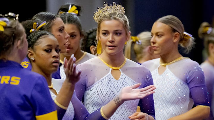 Feb 2, 2024; Baton Rouge, LA, USA;  LSU Lady Tigers senior Olivia 'Livvy' Dunne receives a tiara after performing a floor routine against 