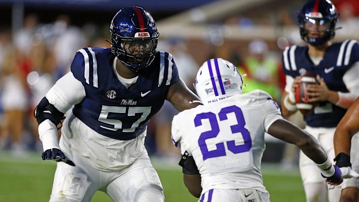 Aug 31, 2024; Oxford, Mississippi, USA; Mississippi Rebels offensive linemen Micah Pettus (57) blocks Furman Paladins linebacker Dylan Chiedo (23) during the first half at Vaught-Hemingway Stadium. Mandatory Credit: Petre Thomas-Imagn Images