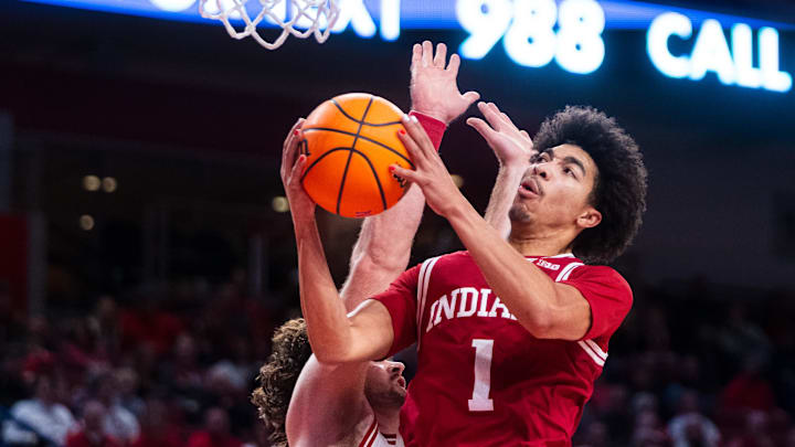 Dec 13, 2024; Lincoln, Nebraska, USA; Indiana Hoosiers guard Myles Rice (1) shoots the ball against Nebraska Cornhuskers forward Andrew Morgan (23) during the second half at Pinnacle Bank Arena. Mandatory Credit: Dylan Widger-Imagn Images