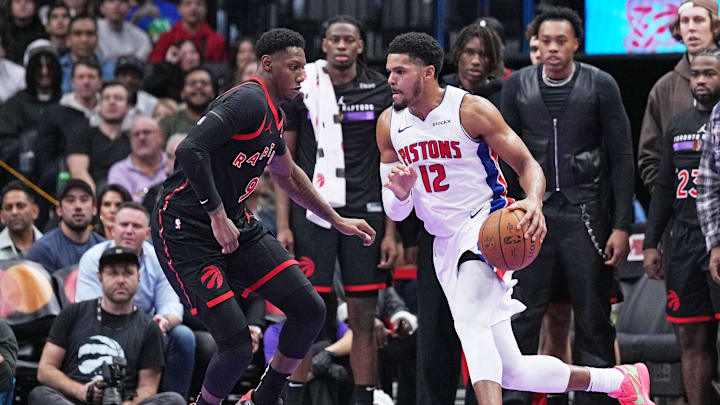 Nov 15, 2024; Toronto, Ontario, CAN; Detroit Pistons forward Tobias Harris (12) controls the ball as Toronto Raptors guard RJ Barrett (9) tries to defend during the fourth quarter at Scotiabank Arena. Mandatory Credit: Nick Turchiaro-Imagn Images Nov 15, 2024; Toronto, Ontario, CAN; Detroit Pistons forward Tobias Harris (12) controls the ball as Toronto Raptors guard RJ Barrett (9) tries to defend during the fourth quarter at Scotiabank Arena. Mandatory Credit: Nick Turchiaro-Imagn Images