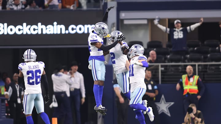 Dec 22, 2024; Arlington, Texas, USA; Dallas Cowboys cornerback Jourdan Lewis (2) celebrates after making an interception in the fourth quarter against the Tampa Bay Buccaneers at AT&T Stadium. Mandatory Credit: Tim Heitman-Imagn Images