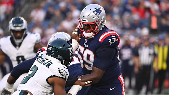 Aug 15, 2024; Foxborough, MA, USA; New England Patriots offensive tackle Vederian Lowe (59) blocks Philadelphia Eagles linebacker Nolan Smith Jr. (3) during the first half at Gillette Stadium.