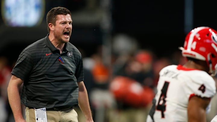 Defensive Coordinator and outside linebackers coach Dan Lanning works with his players before the start of the Southeastern Conference championship NCAA college football game between Georgia and Alabama in Atlanta, on Saturday, Dec. 4, 2021.