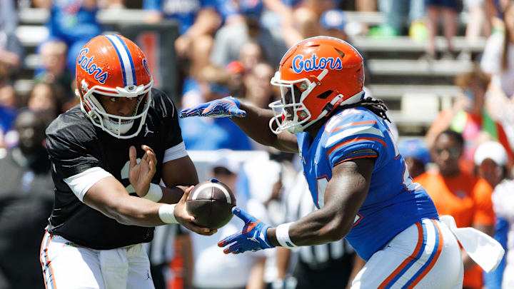 Apr 12, 2025; Gainesville, FL, USA; Florida Gators quarterback DJ Lagway (2) hands the ball to Florida Gators running back Ja'Kobi Jackson (24) during the first half at Ben Hill Griffin Stadium. Mandatory Credit: Matt Pendleton-Imagn Images