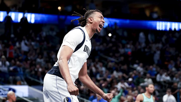 Feb 27, 2025; Dallas, Texas, USA;  Dallas Mavericks center Moses Brown (9) reacts after dunking during the fourth quarter against the Charlotte Hornets at American Airlines Center. Mandatory Credit: Kevin Jairaj-Imagn Images