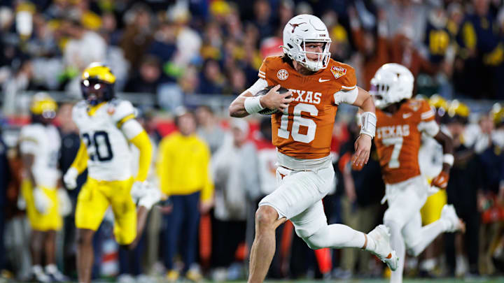 Dec 31, 2025; Orlando, FL, USA; Texas Longhorns quarterback Arch Manning (16) rushes with the ball for a touchdown against the Michigan Wolverines during the second half at Camping World Stadium. Mandatory Credit: Matt Pendleton-Imagn Images