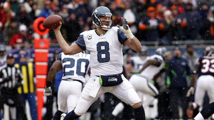 Jan 16, 2011; Chicago, IL, USA; Seattle Seahawks quarterback Matt Hasselbeck (8) throws a pass during the first quarter of the 2011 NFC divisional playoff game against the Chicago Bears at Soldier Field. Mandatory Credit: Mike DiNovo-Imagn Images