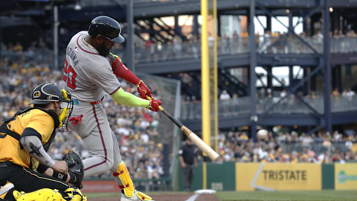 May 24, 2024; Pittsburgh, Pennsylvania, USA;  Atlanta Braves designated hitter Marcell Ozuna (20) hits a double  against the Pittsburgh Pirates during the fourth inning at PNC Park. Mandatory Credit: Charles LeClaire-Imagn Images