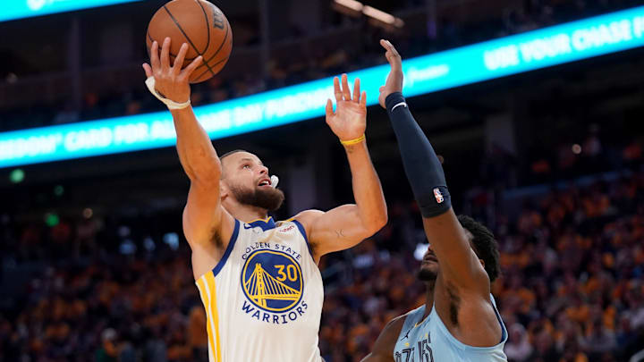 Apr 15, 2025; San Francisco, California, USA; Golden State Warriors guard Stephen Curry (30) shoots the ball over Memphis Grizzlies forward Jaren Jackson Jr. (13) in the third quarter at the Chase Center. Mandatory Credit: Cary Edmondson-Imagn Images