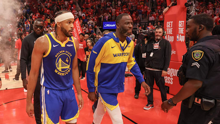 Apr 30, 2025; Houston, Texas, USA; Golden State Warriors guard Moses Moody (4) and  forward Draymond Green (23) walks off the court after loosing to the Houston Rockets in game five of first round for the 2025 NBA Playoffs at Toyota Center. Mandatory Credit: Thomas Shea-Imagn Images