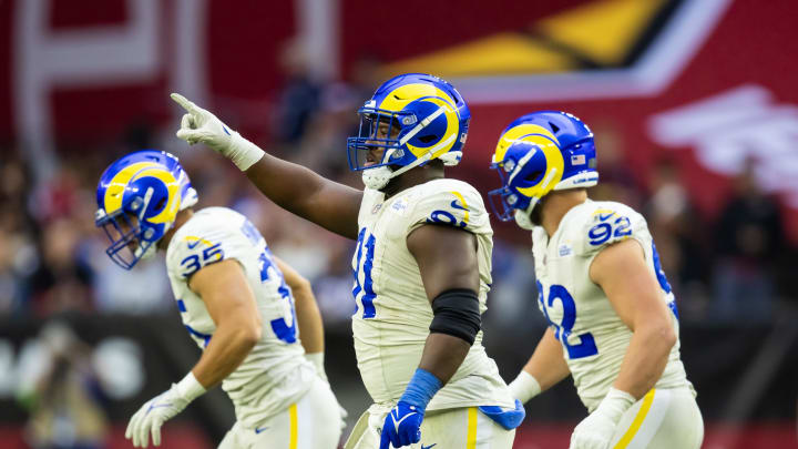 Nov 26, 2023; Glendale, Arizona, USA; Los Angeles Rams defensive tackle Kobie Turner (91) celebrates a play against the Arizona Cardinals at State Farm Stadium. Mandatory Credit: Mark J. Rebilas-USA TODAY Sports Nov 26, 2023; Glendale, Arizona, USA; Los Angeles Rams defensive tackle Kobie Turner (91) celebrates a play against the Arizona Cardinals at State Farm Stadium. Mandatory Credit: Mark J. Rebilas-USA TODAY Sports