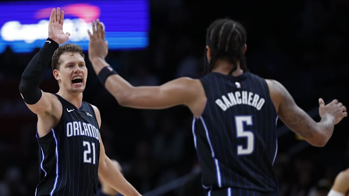 Orlando Magic center Moritz Wagner (21) celebrates with Paolo Banchero (5) against the Washington Wizards in the second half at Capital One Arena. 