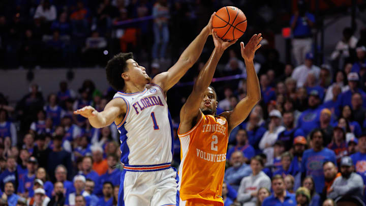Jan 7, 2025; Gainesville, Florida, USA; Florida Gators guard Walter Clayton Jr. (1) blocks a three point basket from Tennessee Volunteers guard Chaz Lanier (2) during the first half at Exactech Arena at the Stephen C. O'Connell Center. Mandatory Credit: Matt Pendleton-Imagn Images