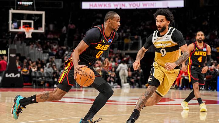 Feb 24, 2026; Atlanta, Georgia, USA; Atlanta Hawks forward Jonathan Kuminga (0) dribbles past Washington Wizards forward Justin Champagnie (9) during the second half at State Farm Arena. Mandatory Credit: Dale Zanine-Imagn Images Feb 24, 2026; Atlanta, Georgia, USA; Atlanta Hawks forward Jonathan Kuminga (0) dribbles past Washington Wizards forward Justin Champagnie (9) during the second half at State Farm Arena. Mandatory Credit: Dale Zanine-Imagn Images