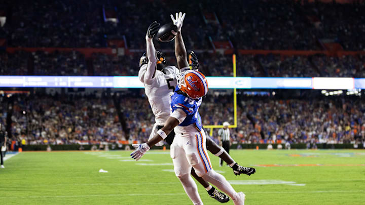Oct 5, 2024; Gainesville, Florida, USA; Florida Gators defensive back Bryce Thornton (18) breaks up a pass to UCF Knights tight end Randy Pittman Jr. (5) during the first half at Ben Hill Griffin Stadium. Mandatory Credit: Matt Pendleton-Imagn Images
