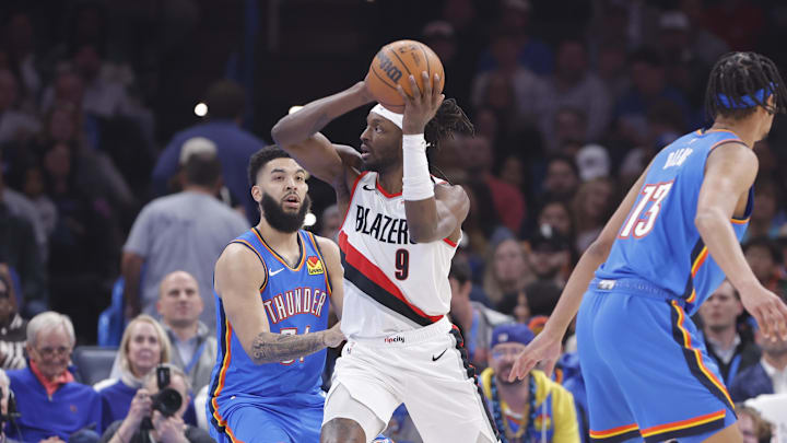 Mar 7, 2025; Oklahoma City, Oklahoma, USA; Portland Trail Blazers forward Jerami Grant (9) drives to the basket around Oklahoma City Thunder forward Kenrich Williams (34) during the first quarter at Paycom Center. Mandatory Credit: Alonzo Adams-Imagn Images