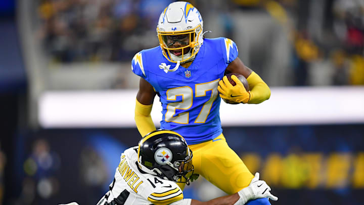 Nov 9, 2025; Inglewood, California, USA; Pittsburgh Steelers running back Kenneth Gainwell (14) tackles Los Angeles Chargers safety RJ Mickens (27) after an interception during the second quarter of the game at SoFi Stadium. Mandatory Credit: Gary A. Vasquez-Imagn Images