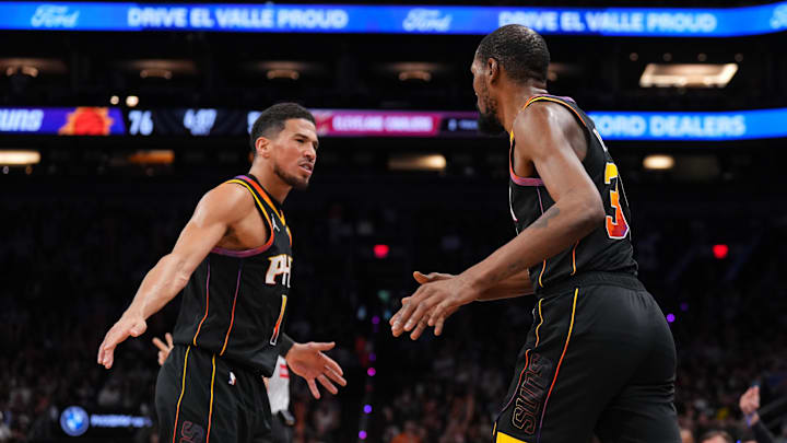 Mar 21, 2025; Phoenix, Arizona, USA; Phoenix Suns guard Devin Booker (1) and Phoenix Suns forward Kevin Durant (35) slap hands against the Cleveland Cavaliers during the second half at Footprint Center. Mandatory Credit: Joe Camporeale-Imagn Images Mar 21, 2025; Phoenix, Arizona, USA; Phoenix Suns guard Devin Booker (1) and Phoenix Suns forward Kevin Durant (35) slap hands against the Cleveland Cavaliers during the second half at Footprint Center. Mandatory Credit: Joe Camporeale-Imagn Images