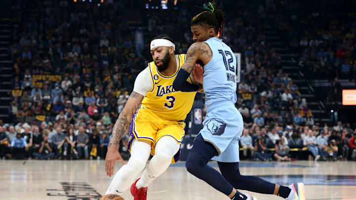Former Los Angeles Lakers forward Anthony Davis (3) drives to the basket as Memphis Grizzlies guard Ja Morant.
