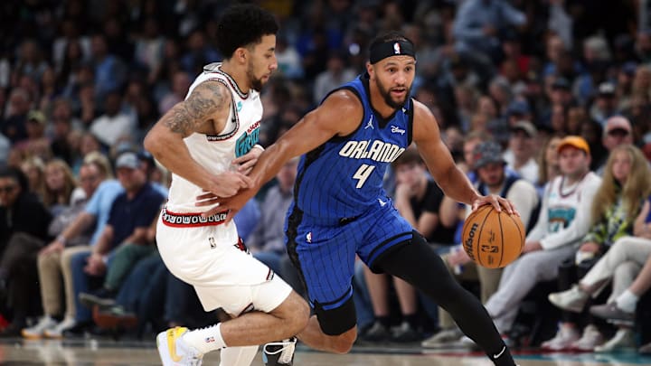 Orlando Magic guard Jalen Suggs (4) drives to the basket as Memphis Grizzlies guard Scotty Pippen Jr. (1) defends during the first half at FedExForum. Orlando Magic guard Jalen Suggs (4) drives to the basket as Memphis Grizzlies guard Scotty Pippen Jr. (1) defends during the first half at FedExForum.