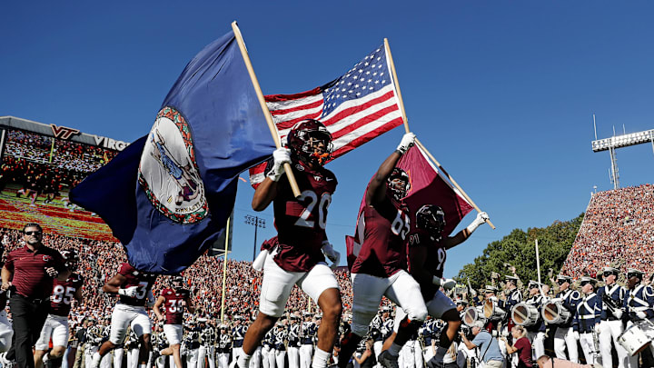 Sep 7, 2024; Blacksburg, Virginia, USA; The Virginia Tech Hokies runs onto the field before the game against the Marshall Thundering Herd at Lane Stadium. Mandatory Credit: Peter Casey-Imagn Images