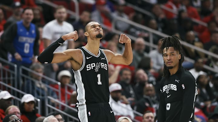 Jan 28, 2026; Houston, Texas, USA; San Antonio Spurs forward Victor Wembanyama (1) and guard Stephon Castle (5) react after a play during the fourth quarter against the Houston Rockets at Toyota Center. Mandatory Credit: Troy Taormina-Imagn Images